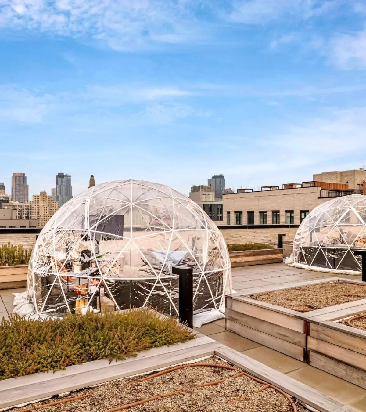 Outdoor igloo rentals installed on a New York City rooftop terrace for a winter event