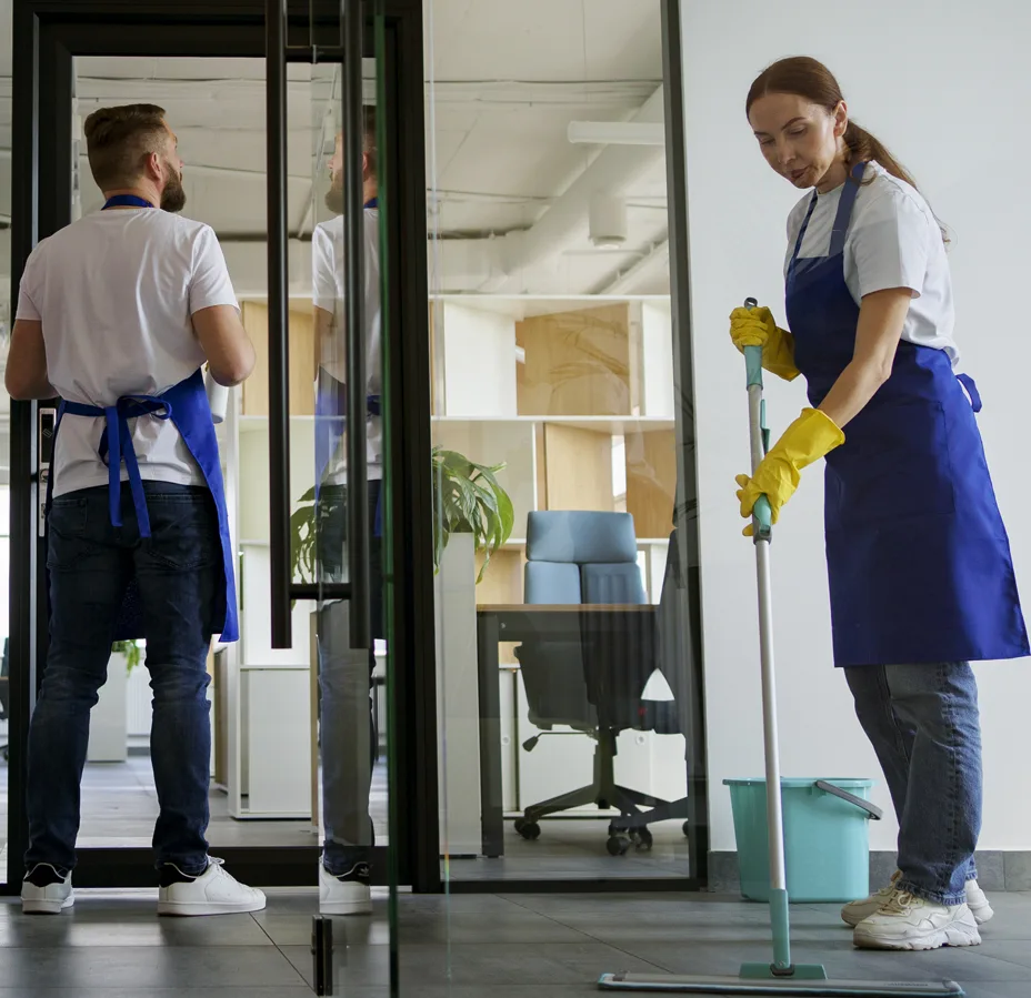 Two office cleaners working together highlighting rising labor costs