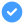 Blue circle with a black checkmark icon in the center, symbolizing verification, completion, or approval, on a dark background.