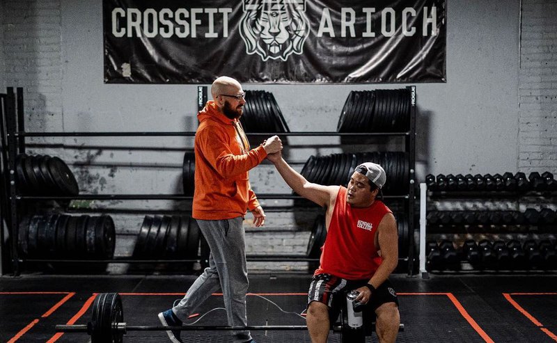 Greg Buck with CrossFit Arioch member