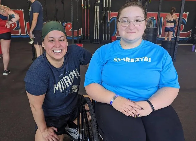 Davis with adaptive athlete from Uniquely Abled Fitness