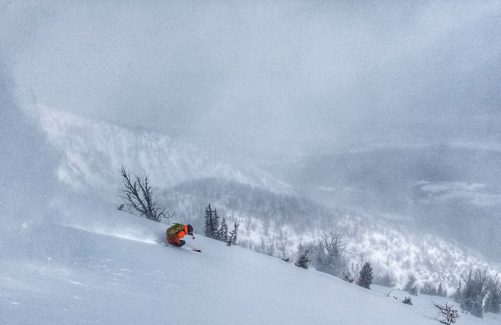A skier navigates the steep backcountry in Grand Teton.