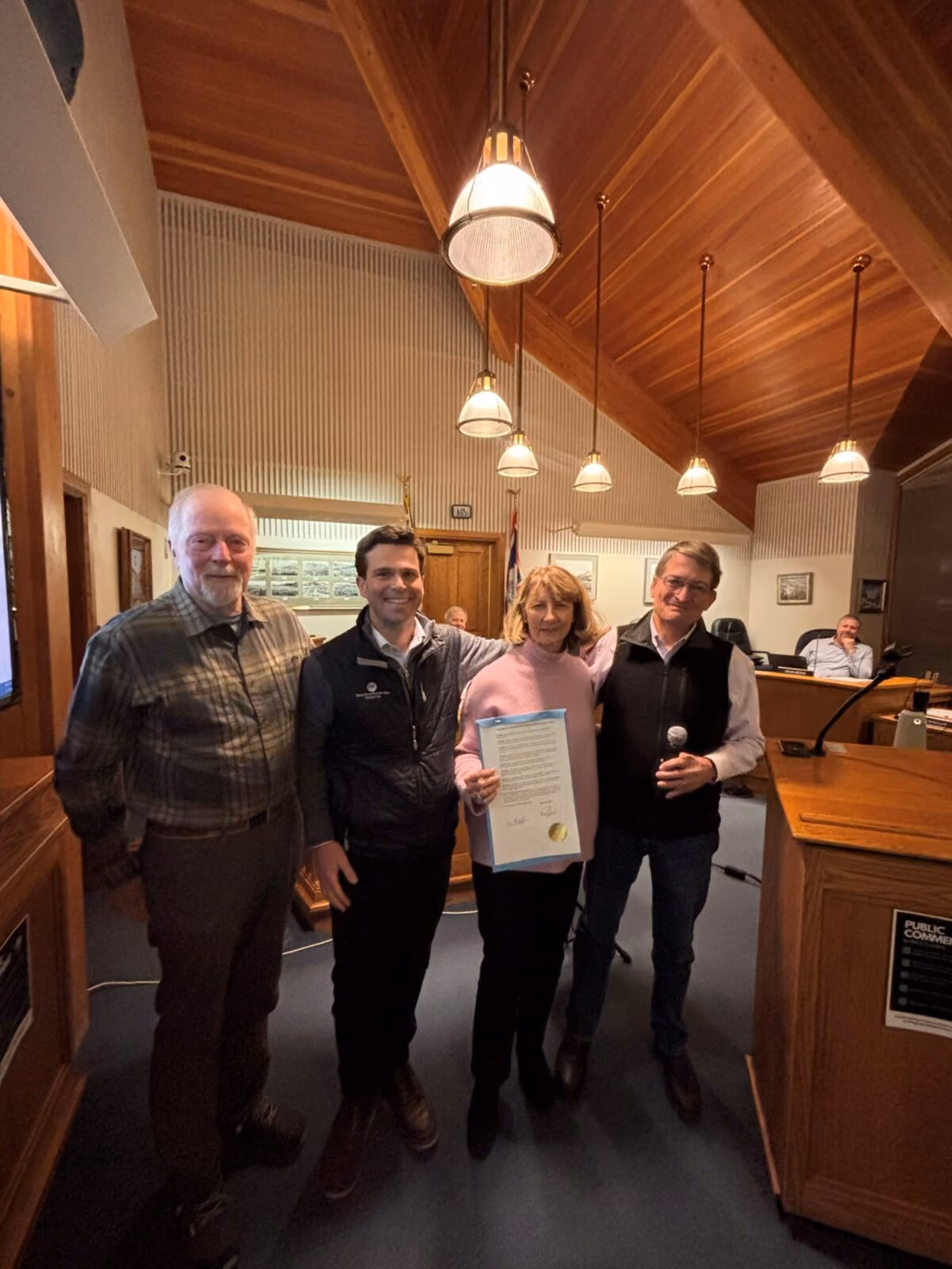 GTNPF Board Member Rob Wallace, GTNPF Vice President of Partnership Projects Ryan Kelly, GTNPF President Leslie Mattson, and Jackson Mayor Arne Jorgenson celebrate the official proclamation honoring the Kelly parcel purchase.