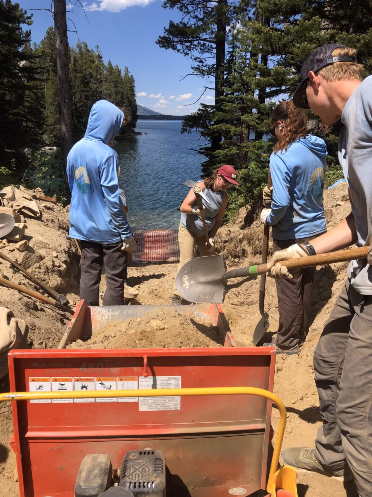 YCP remove soil and rocks to improve the grade of the portage.