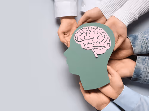 Man sitting thoughtfully, appearing distracted or mentally overwhelmed
