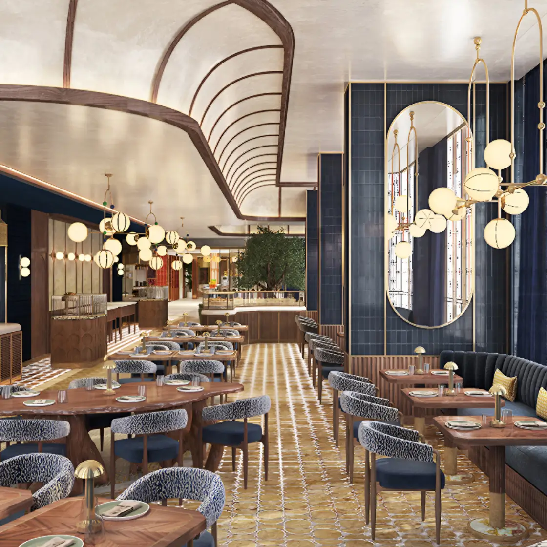 Elegant restaurant interior with wooden tables, blue cushioned chairs, gold lighting fixtures, and a large arched mirror on the wall.