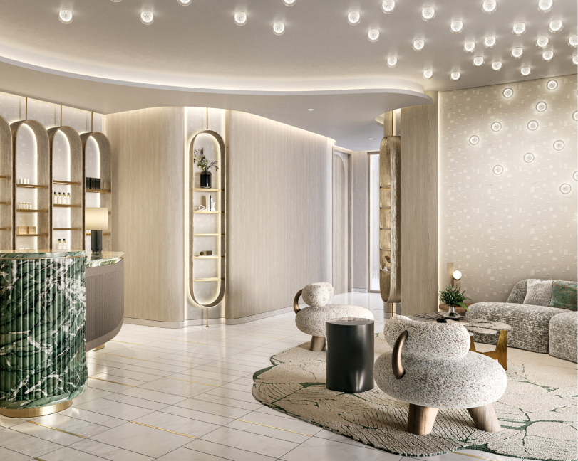 A high-end hotel lobby or reception area with marble floors, rounded architectural lines, and designer furniture.