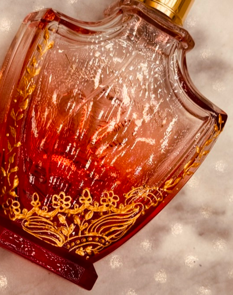 Maadia Noor at a luxury Creed counter featuring the brand's iconic fragrance and gift collection.