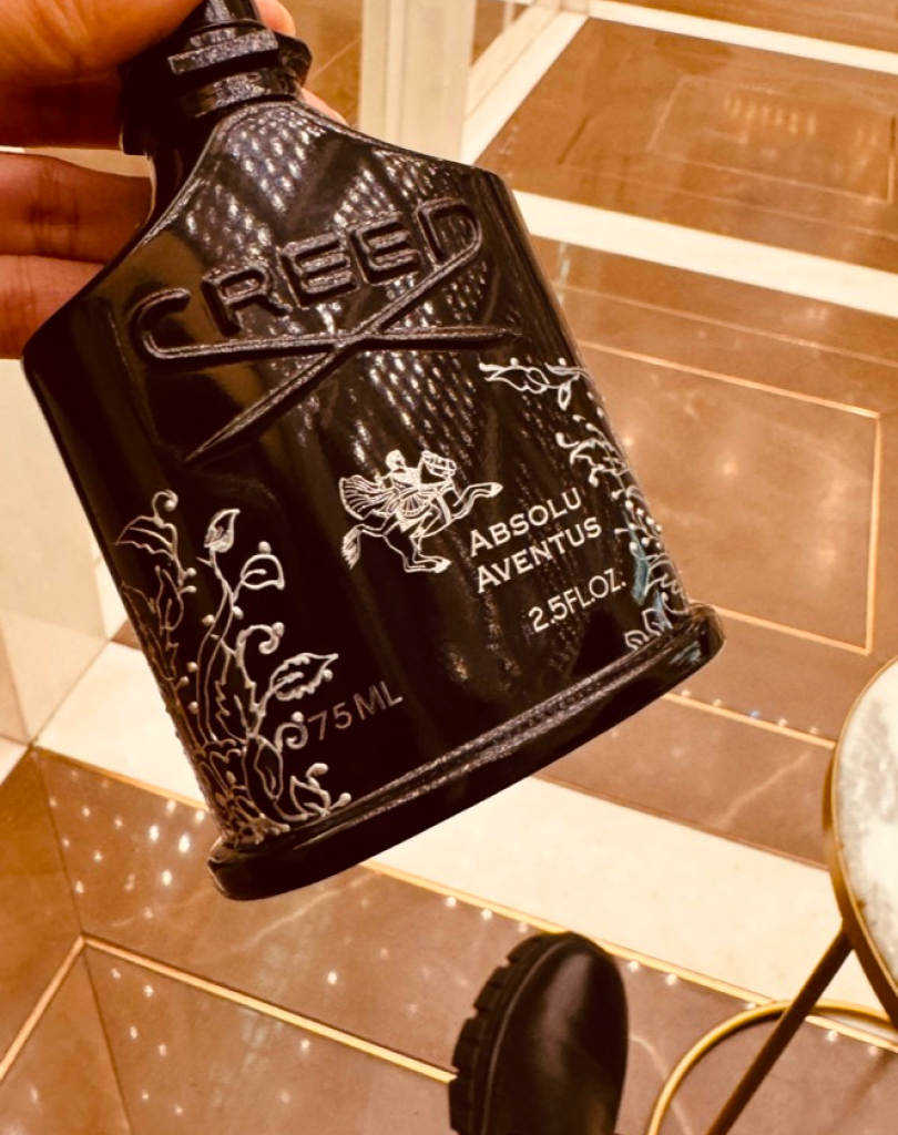 Event signage for a Creed personalization residency with calligrapher Maadia Noor at Harvey Nichols.