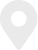 Black location pin icon on a light gray circular background.