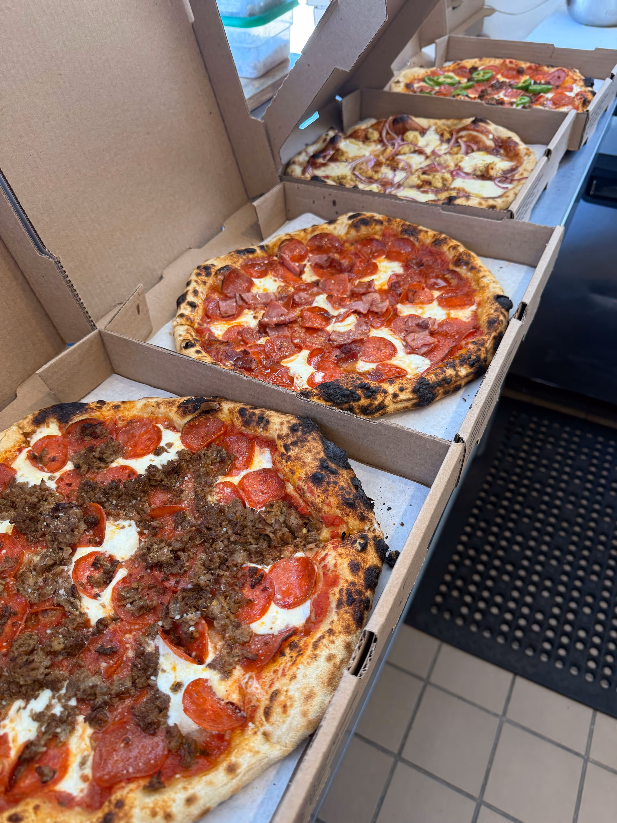 Four boxes of pizzas