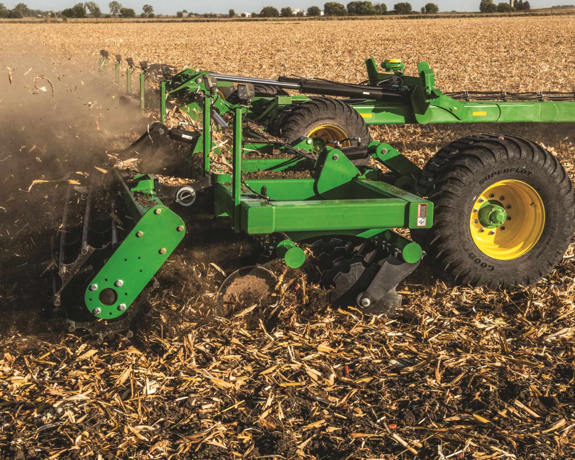 A disk harrow attachment plows a field preparing it for fall overseeding.