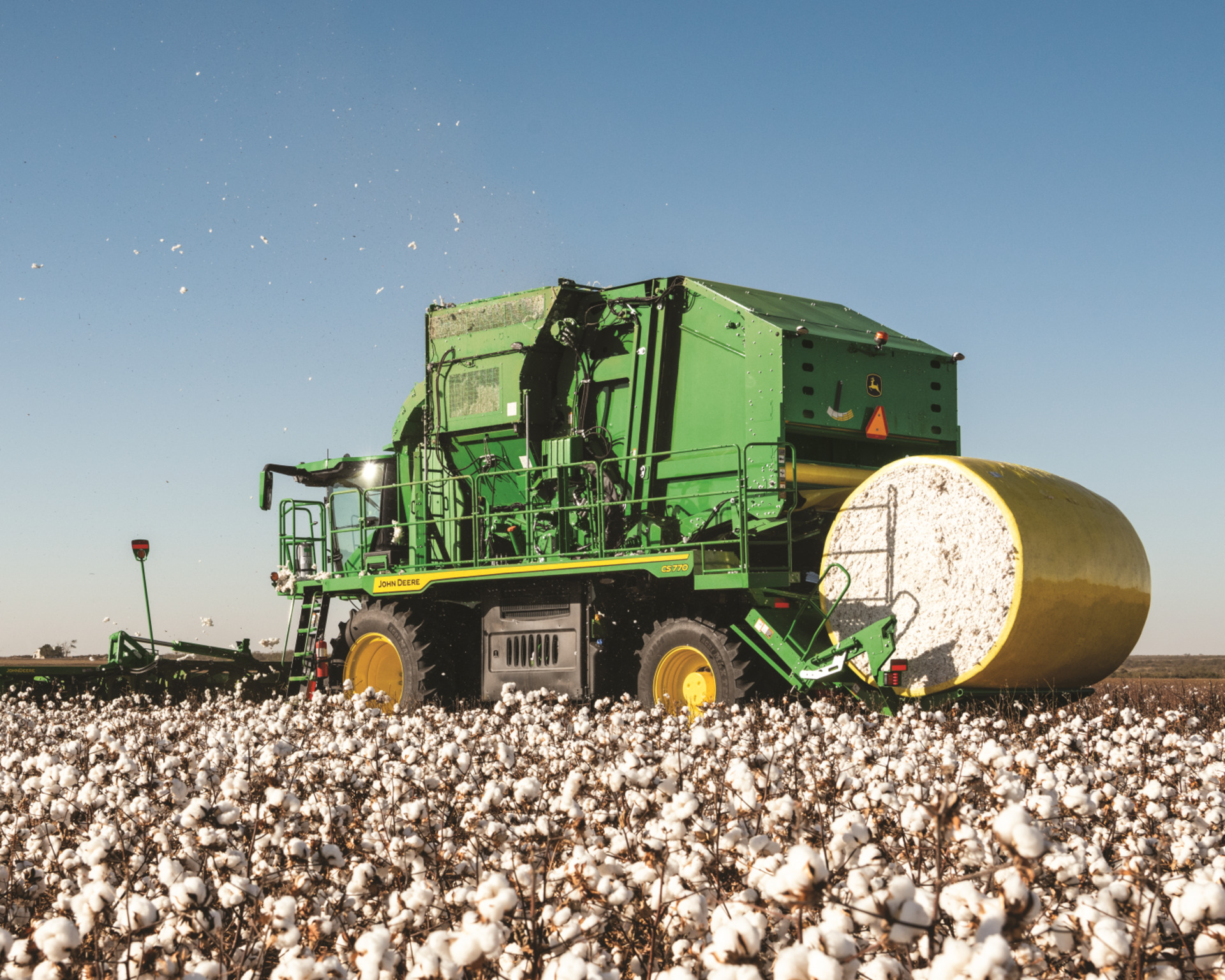 A cotton stripper bales cotton on a farm in Texas.