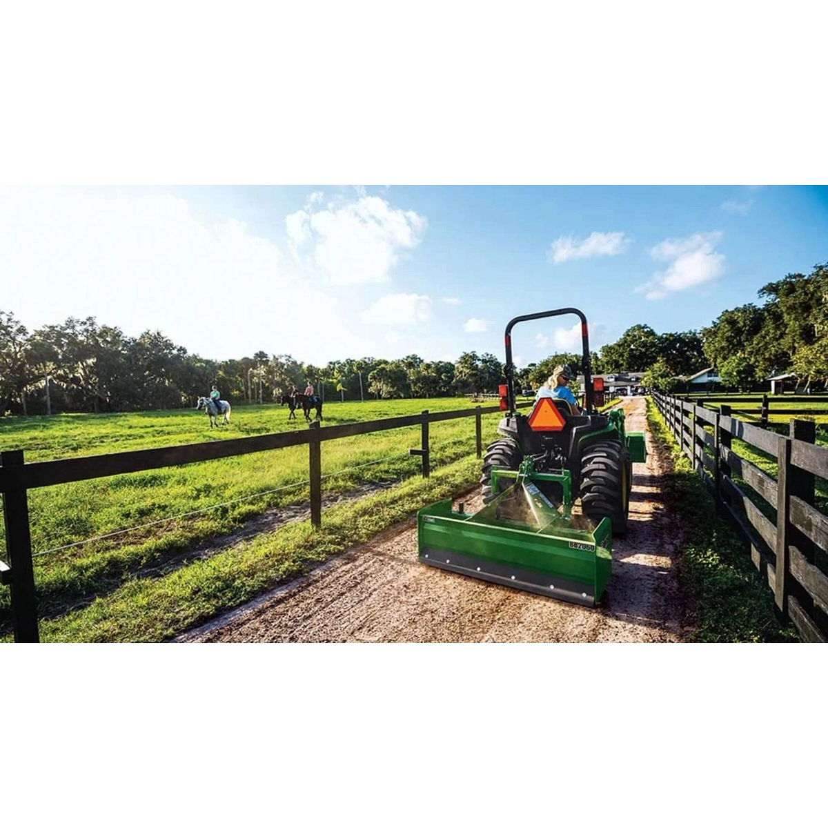 3025E 3 Series Compact Tractors with there is a tractor that is parked in a field