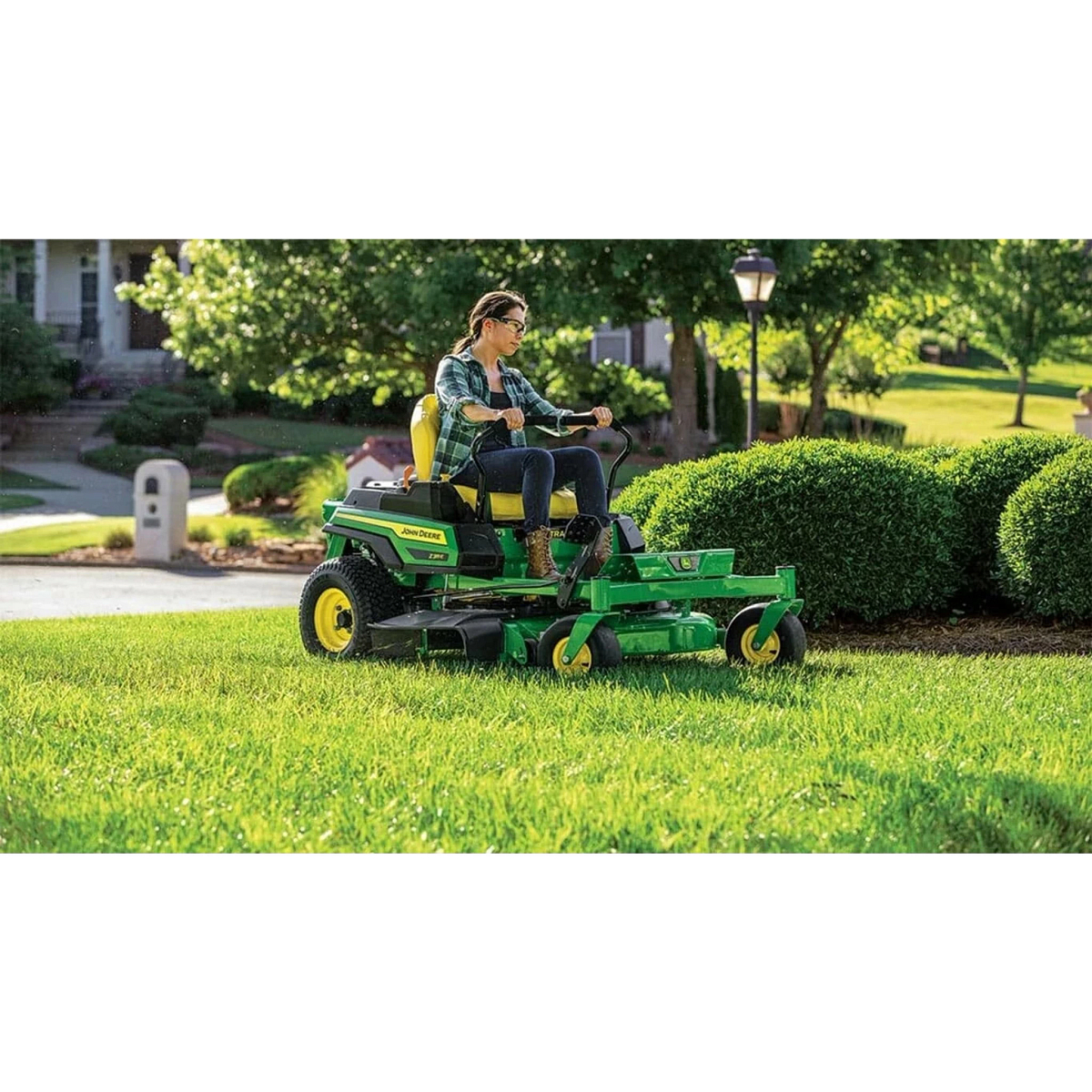 Homeowner mowing a yard with a Z315E ZTrak Mower