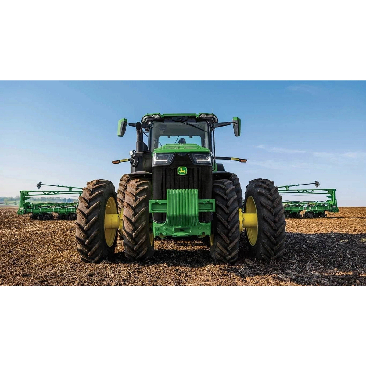8R 370 Tractor in a corn field with tillage attachment.