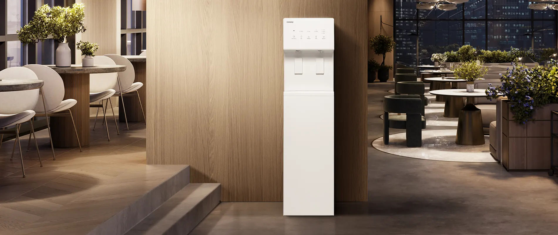 Modern white Coway CHP-5722L water purifier against a wood-paneled wall in a stylish lounge area with tables, chairs, and plants.