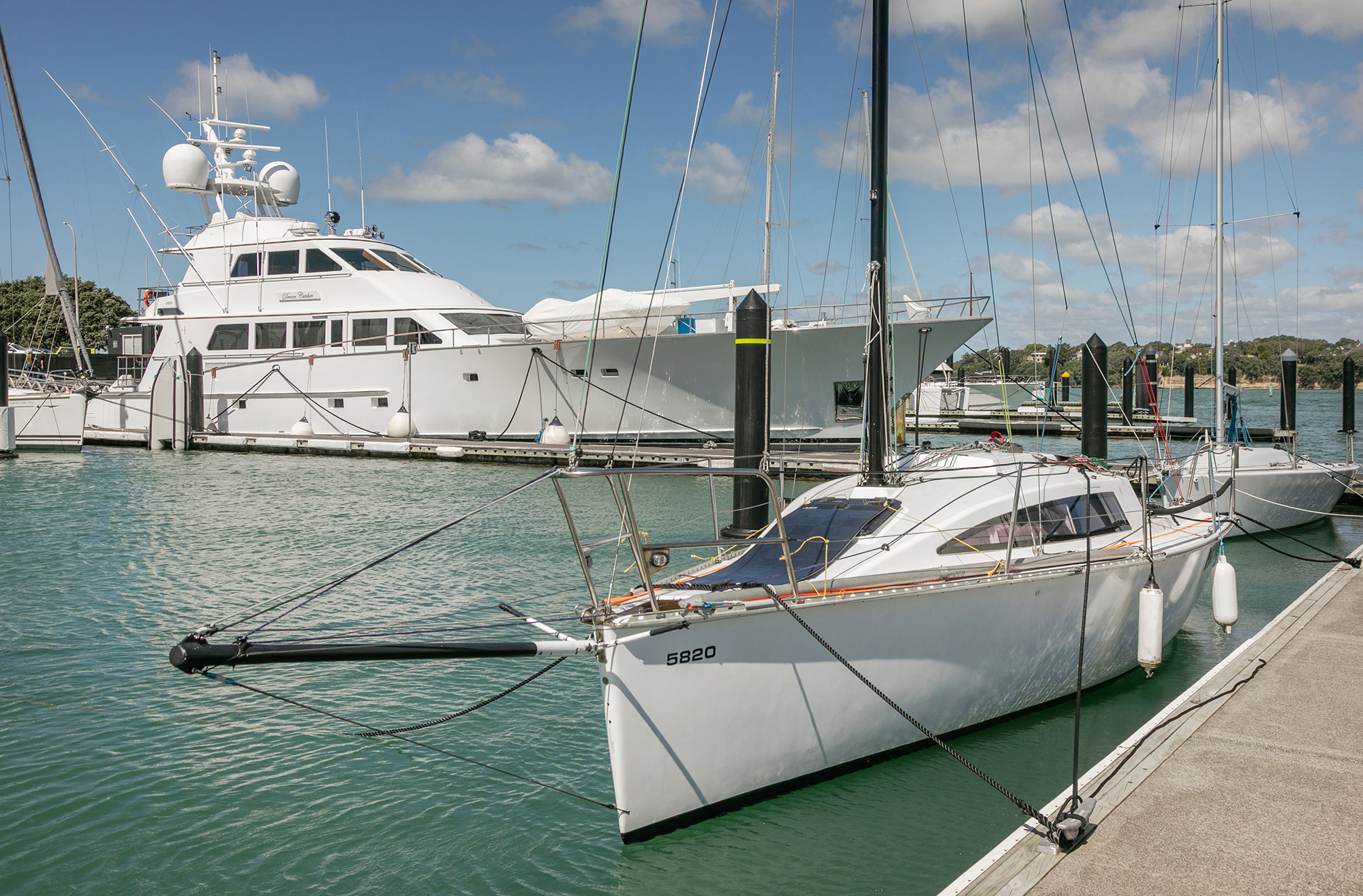 A yacht and superyacht berthed at Bayswater