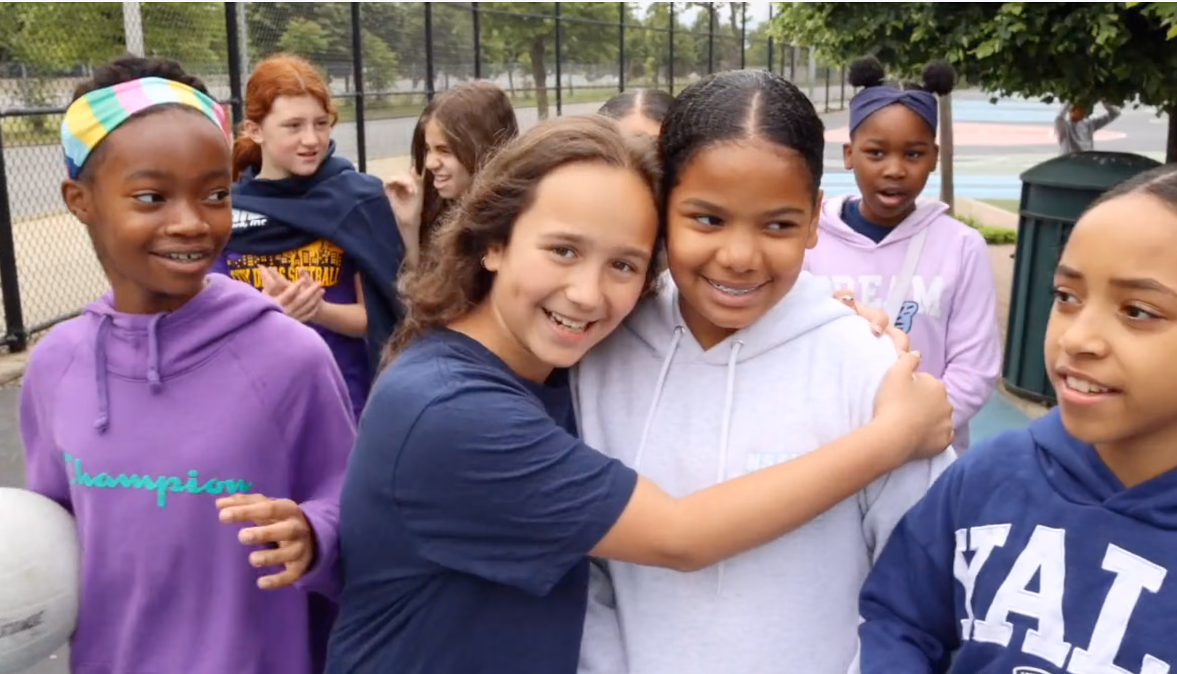 Group of smiling Bronx Delta students outdoors