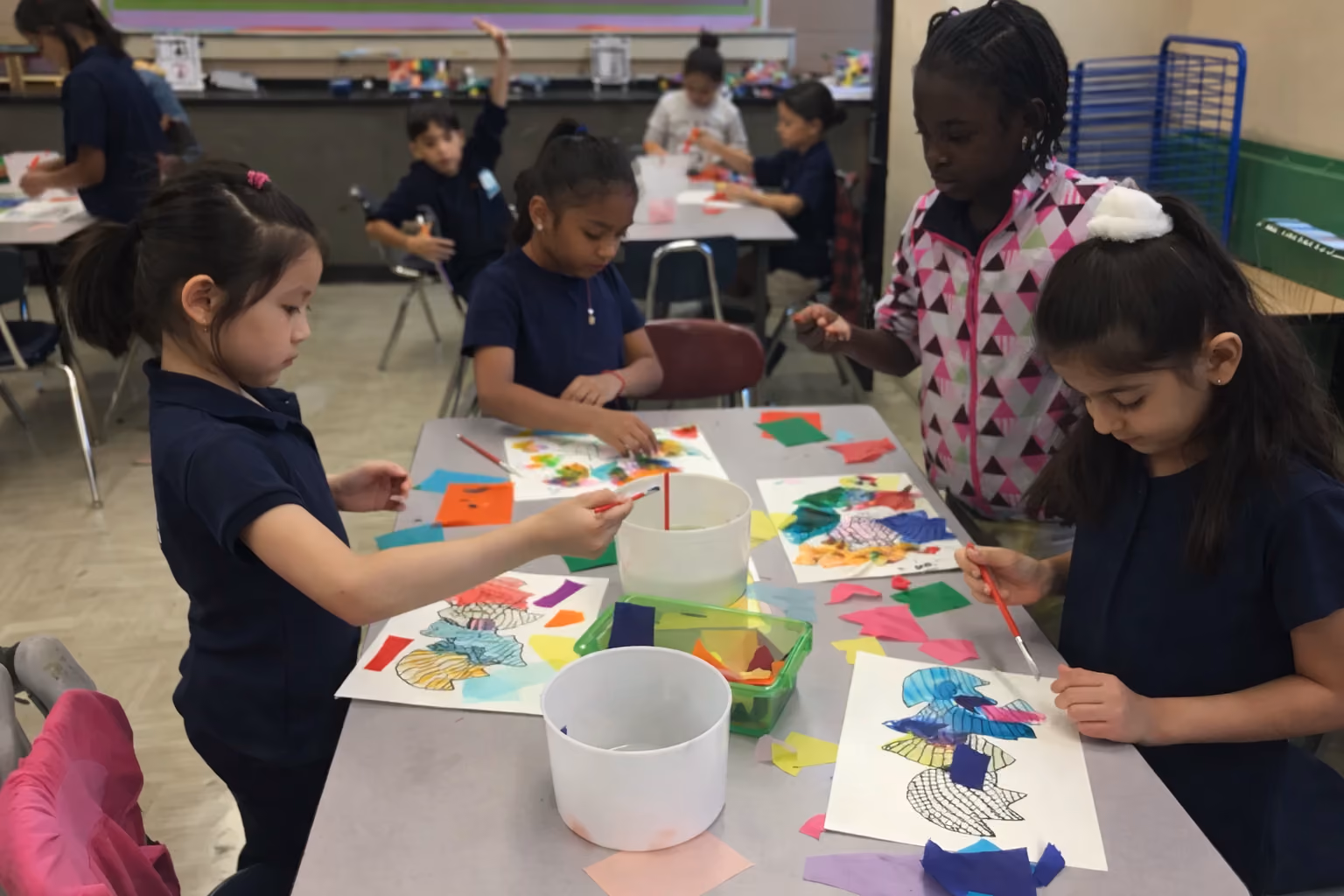 Students painting with watercolors in art class