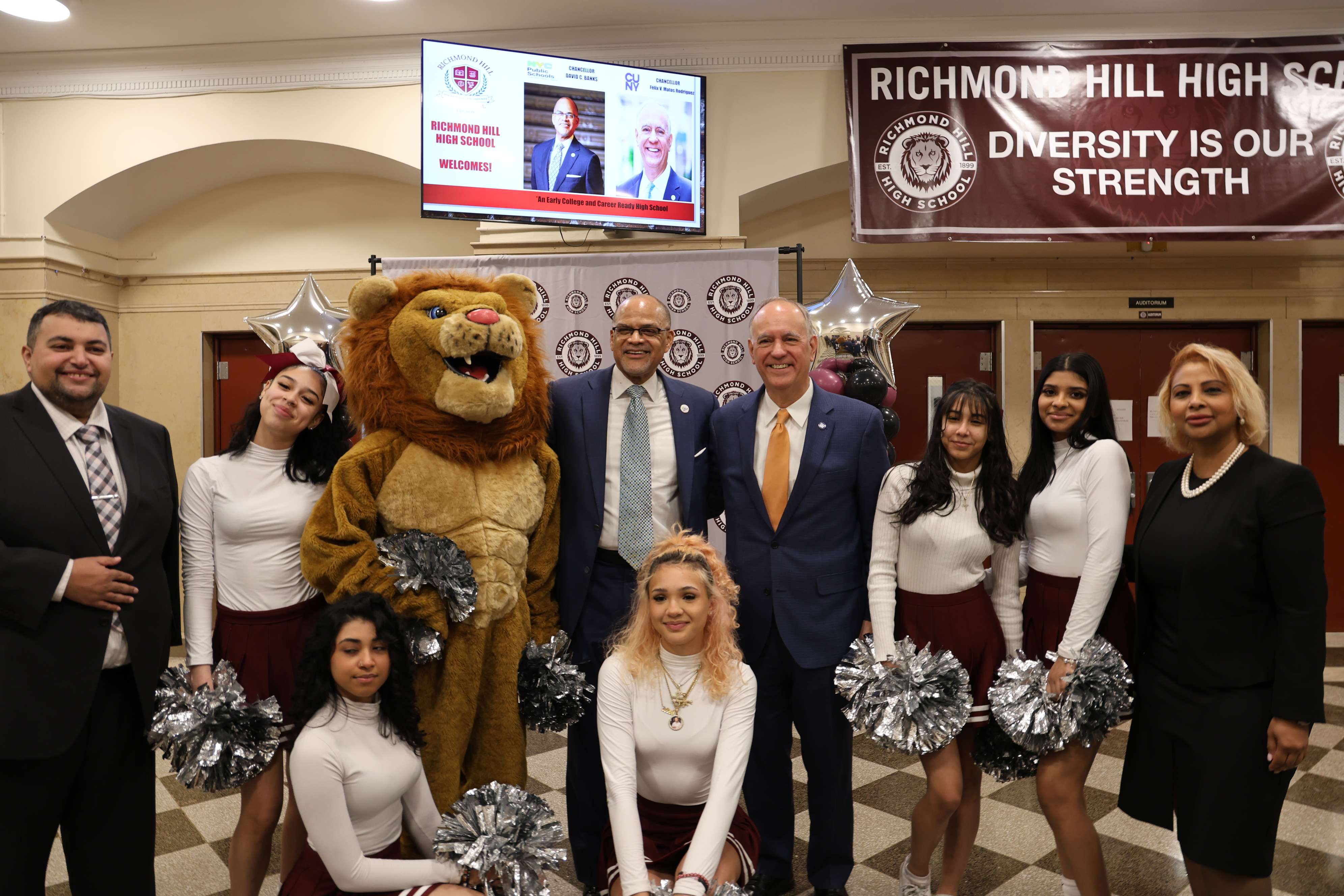 Richmond Hill High School mascot with cheerleaders and administrators