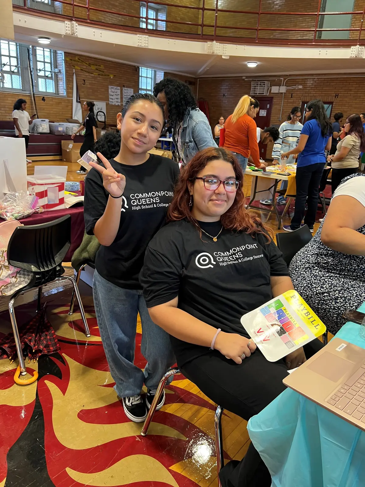 Two Commonpoint Queens students at a school college fair event
