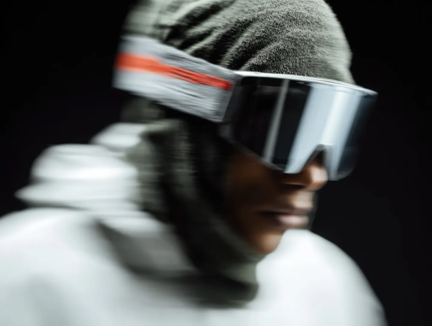 Futuristic portrait wearing reflective visor.