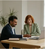 Person mopping a shiny floor near large windows with city view in the background.