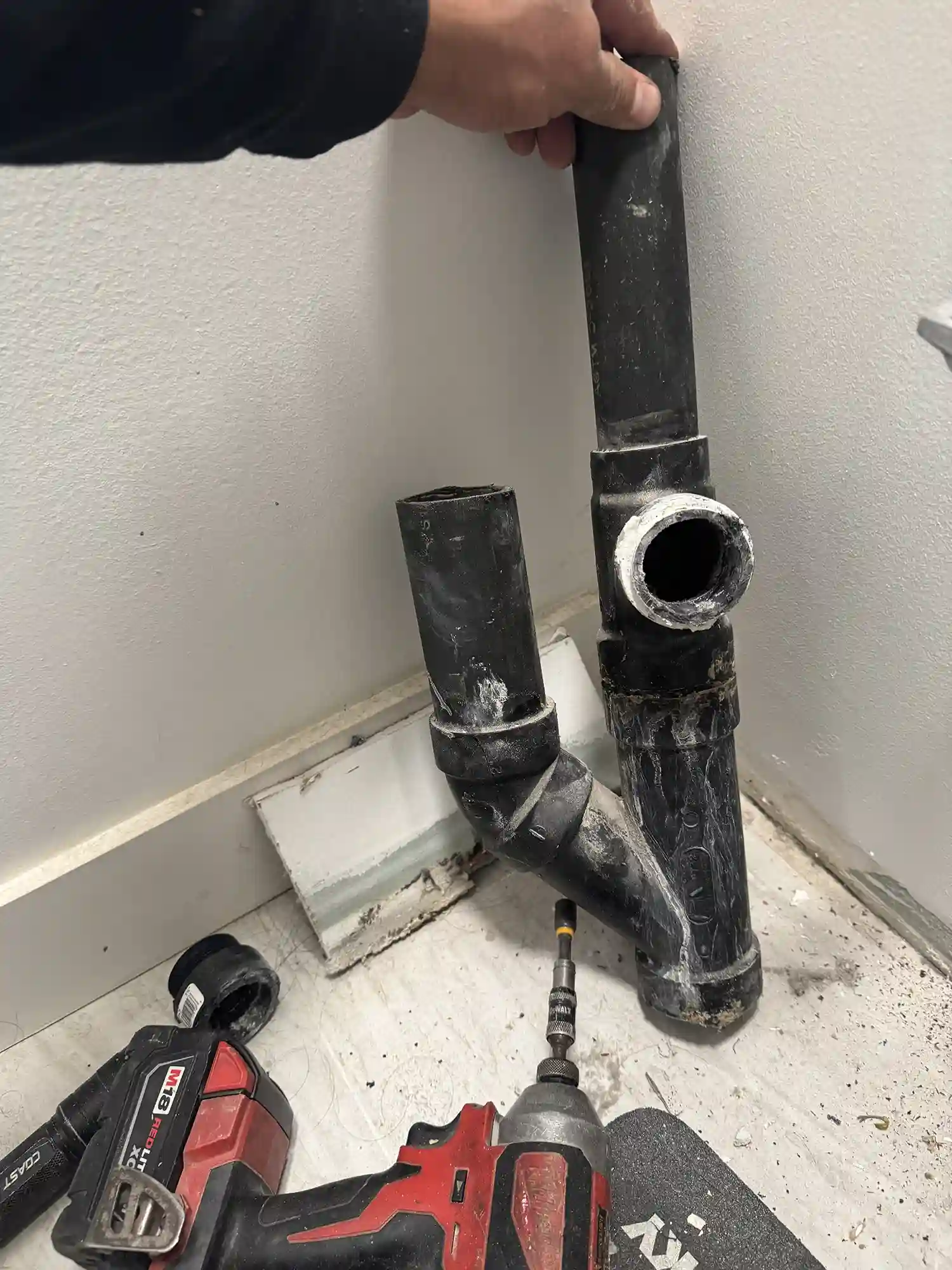 Corroded bathroom drain pipe removed during a plumbing line replacement in Yucaipa, CA.