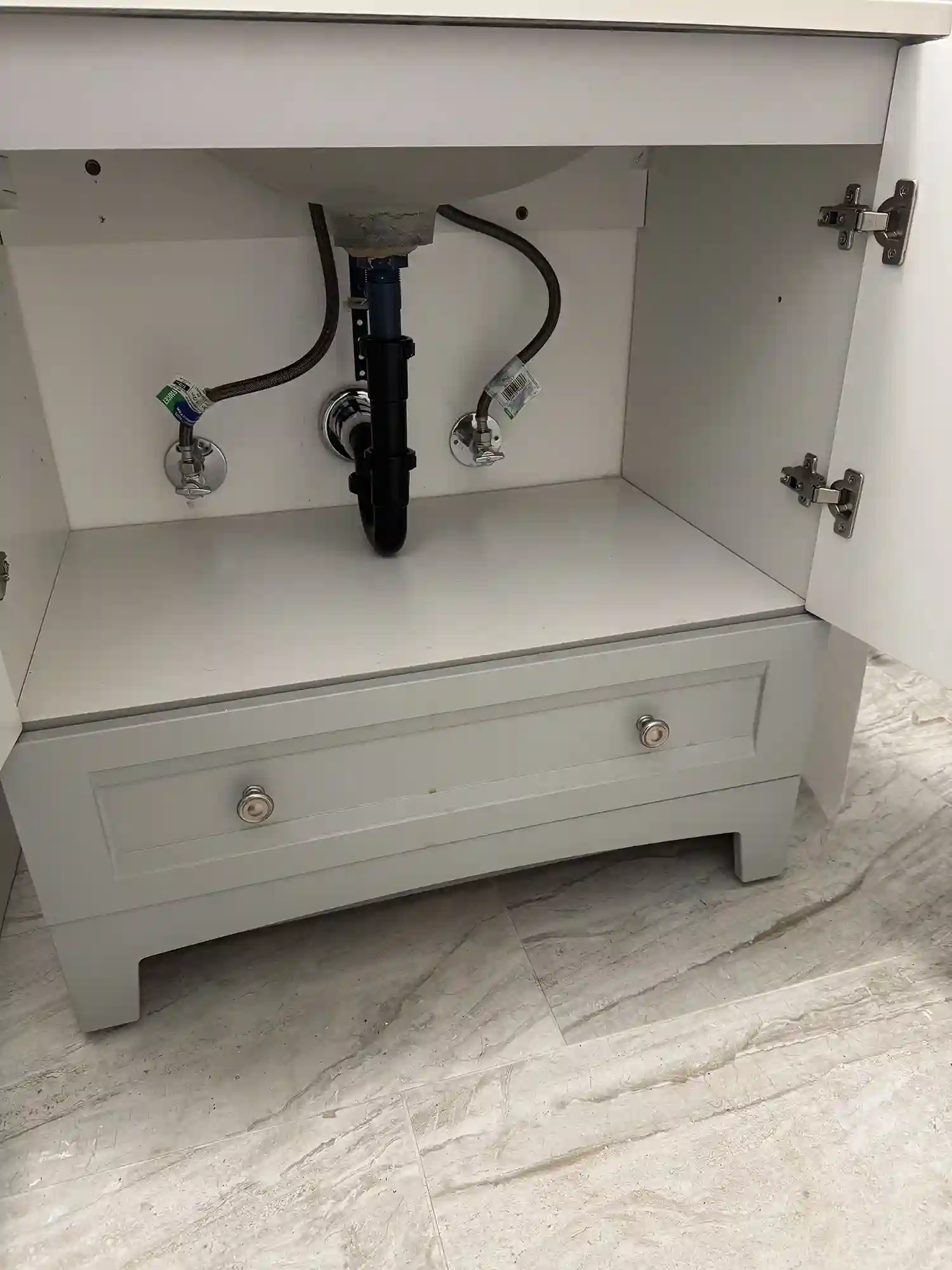 Clean bathroom vanity plumbing and P-trap installation by Prime Plumbing in Yucaipa, CA.