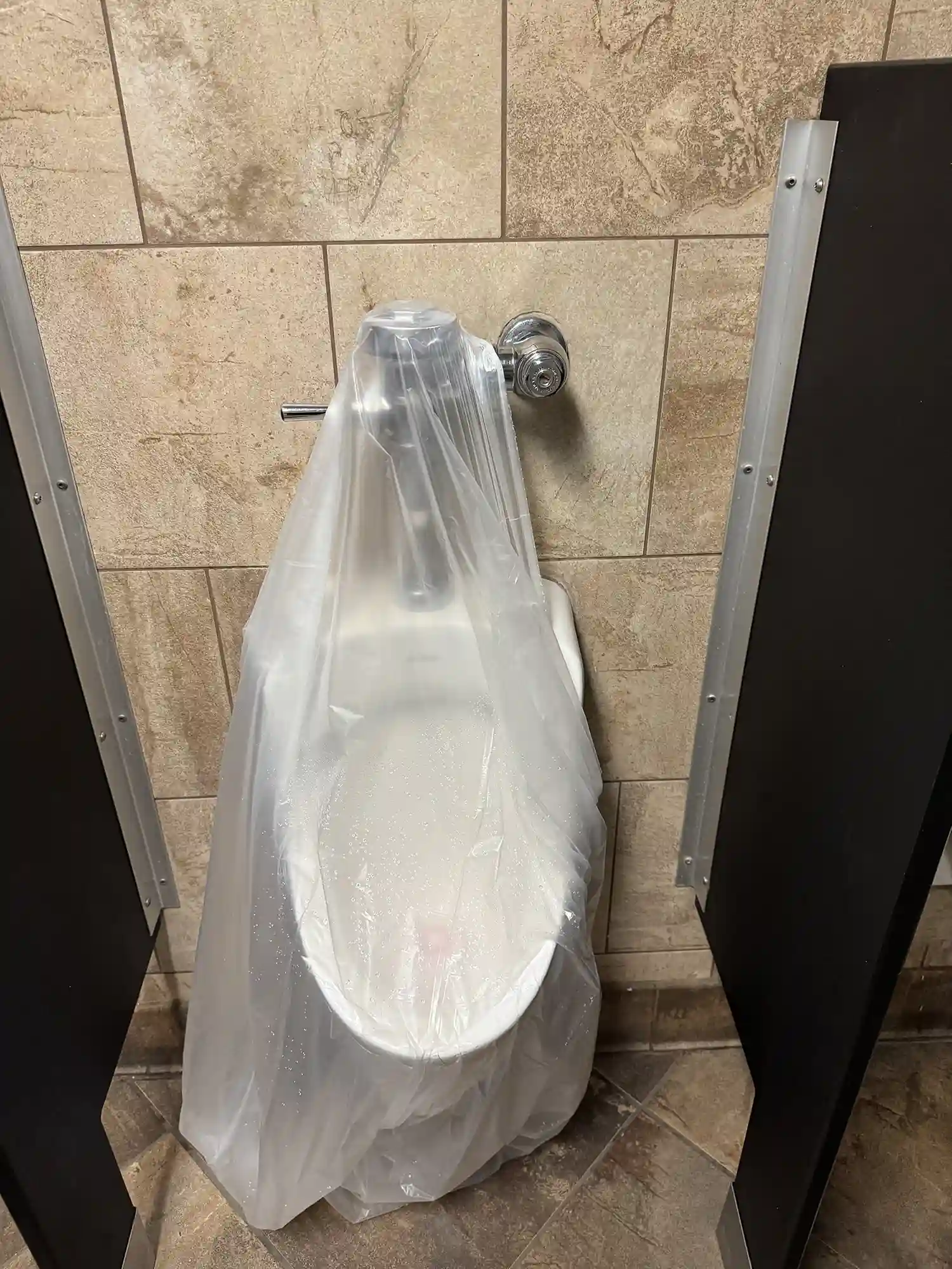 Urinal installation for commercial use by Prime Plumbing in Yucaipa.