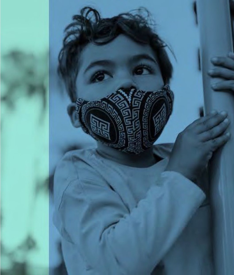 A child looking out from a doorway