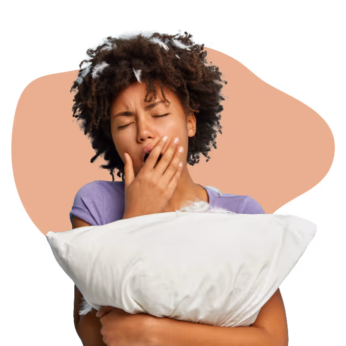 Tired woman yawning while hugging a white pillow against a peach background shape.