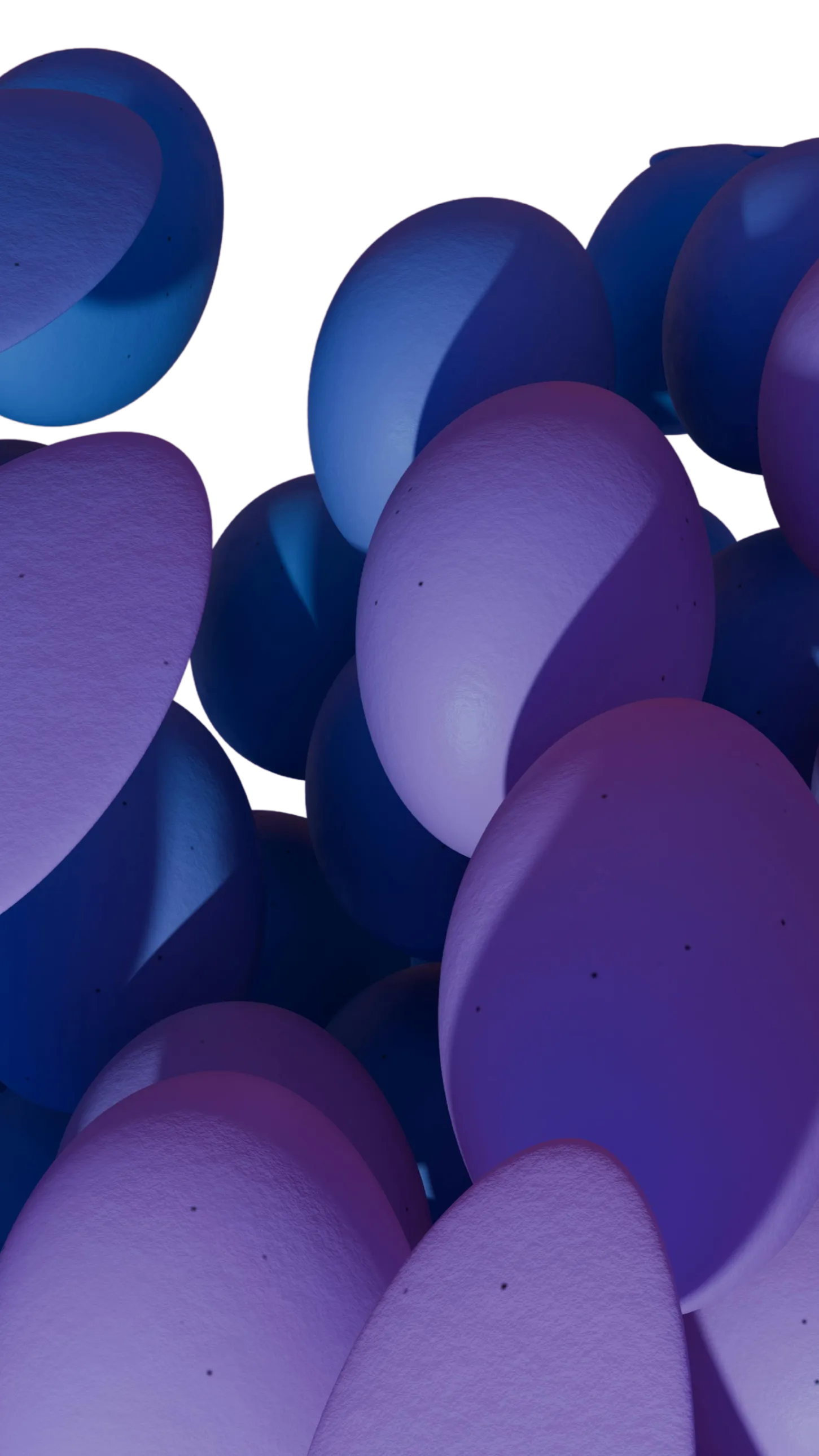 Close-up view of smooth, oval shapes in shades of purple and blue with subtle speckles and shadows.