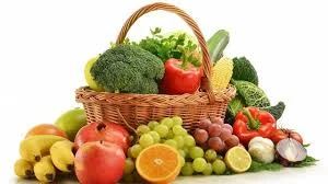 Fresh fruits and vegetables arranged on a plate for macro nutrition portions