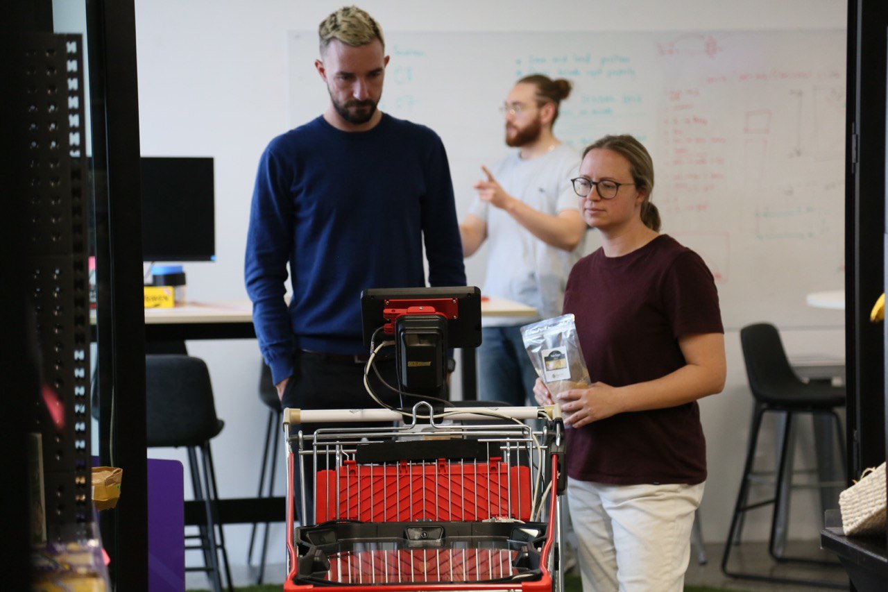 Reviewing a cart prototype with the Product Manager in the office test store