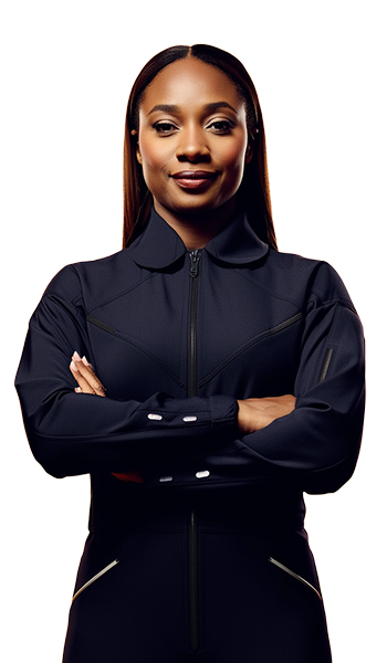 Confident young woman with long hair crossing her arms while wearing a black zip-up jacket.