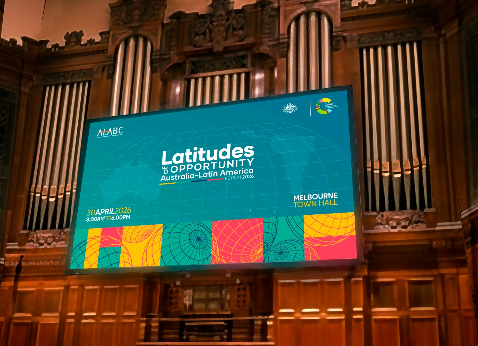 Large screen in elegant hall displaying promotional graphic for Latitudes to Opportunity Australia-Latin America Forum 2026 at Melbourne Town Hall on 30 April 2026.