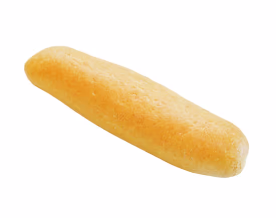 Light golden brown elongated bread roll isolated on white background.