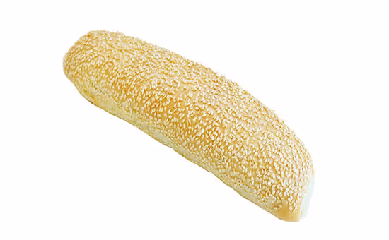 Long bread loaf topped with sesame seeds on a white background.