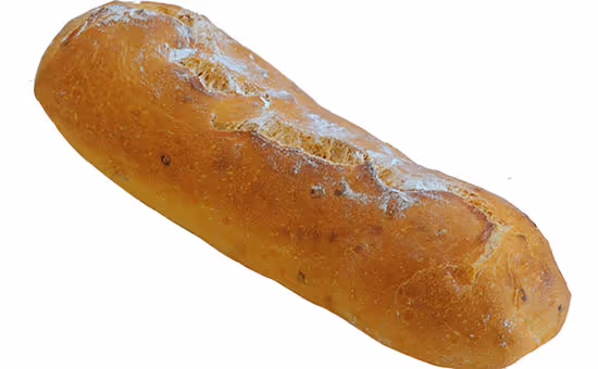 Loaf of crusty, golden brown bread with flour dusting on top.