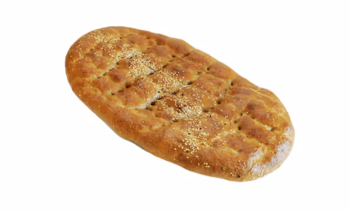 Oval loaf of seeded whole grain flatbread with a golden crust on a white background.