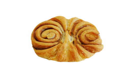Golden brown cinnamon pastry with swirled rolls on a white background.
