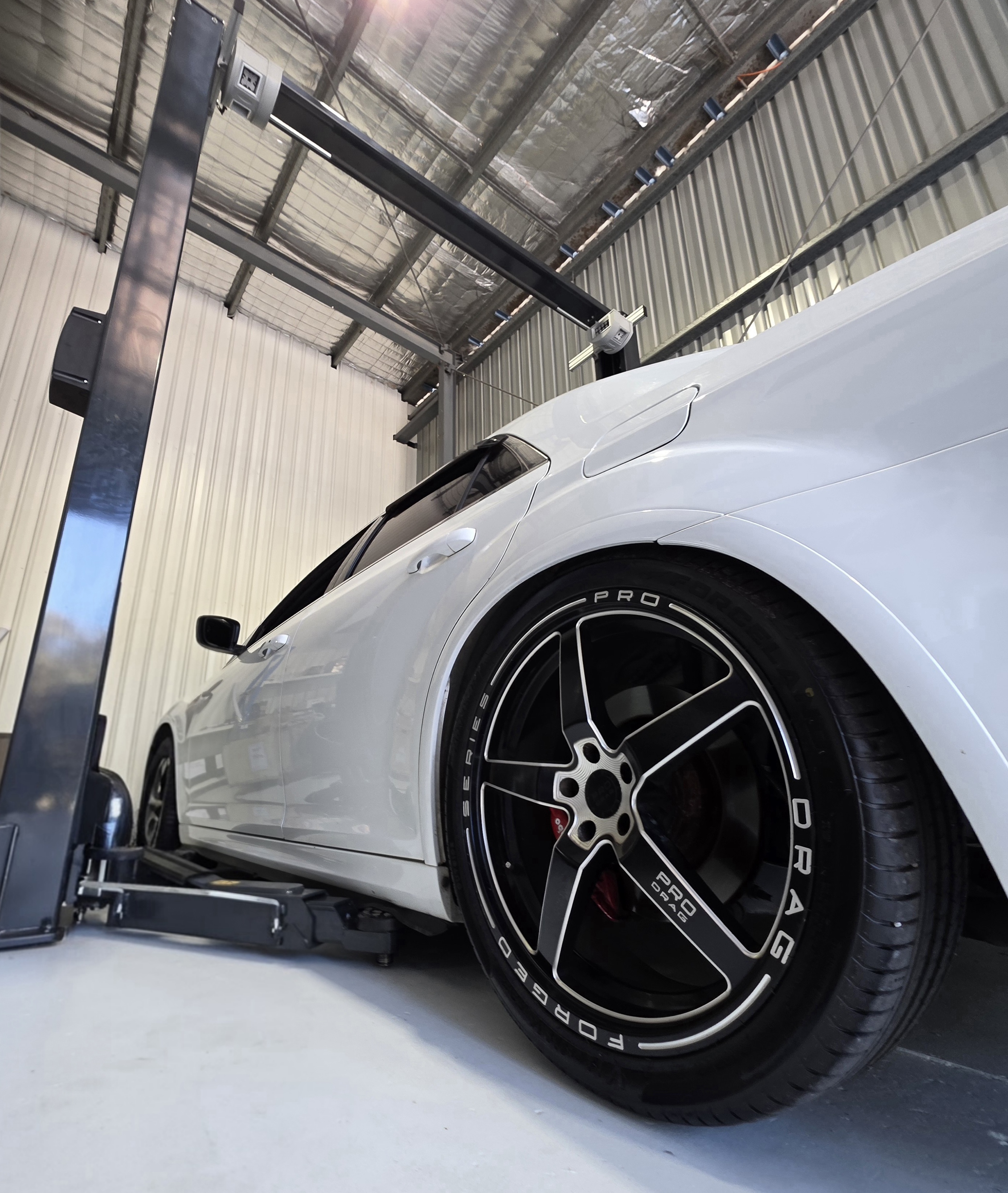 image of mechanics at work on a car
