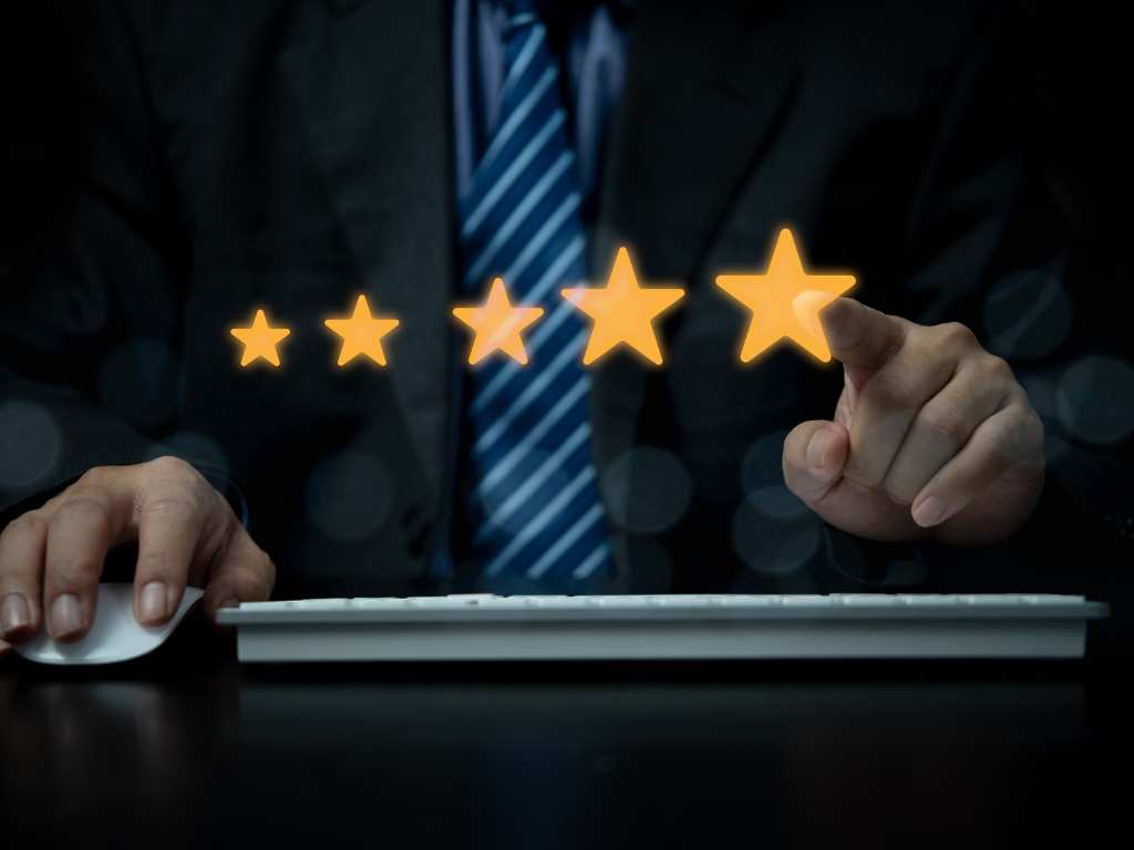 A man leaving a five-star review for a successful property management.