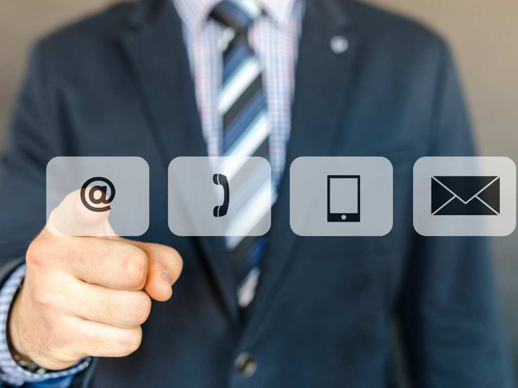A man selecting contact icons, representing the responsiveness of a property manager.
