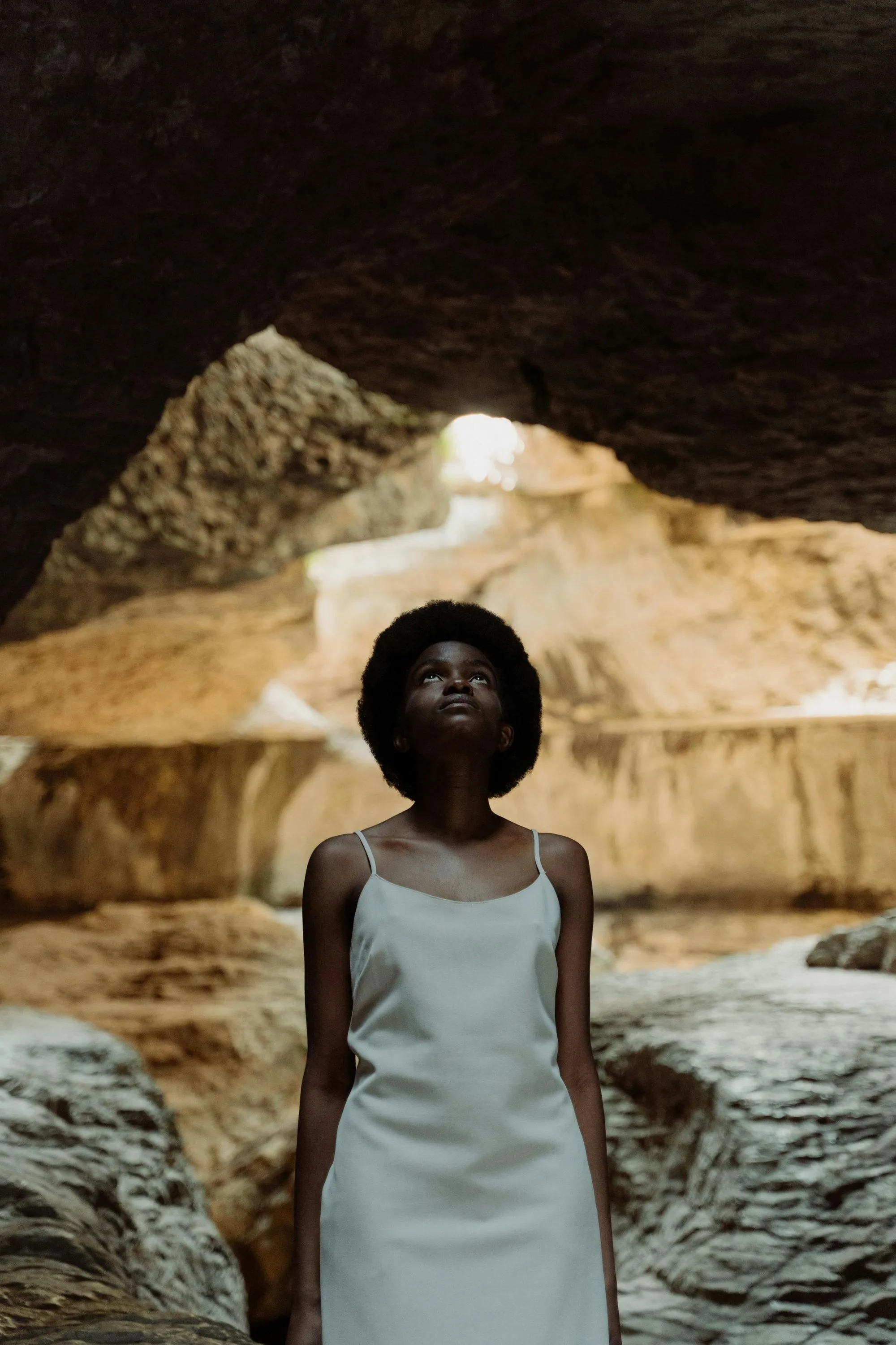 Black woman inside a cave