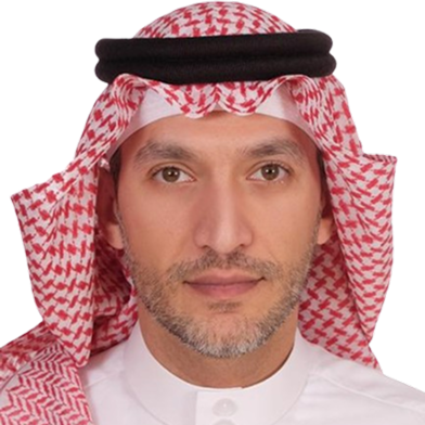 Portrait of a CEO wearing a white thobe and red-and-white checkered keffiyeh with an agal.