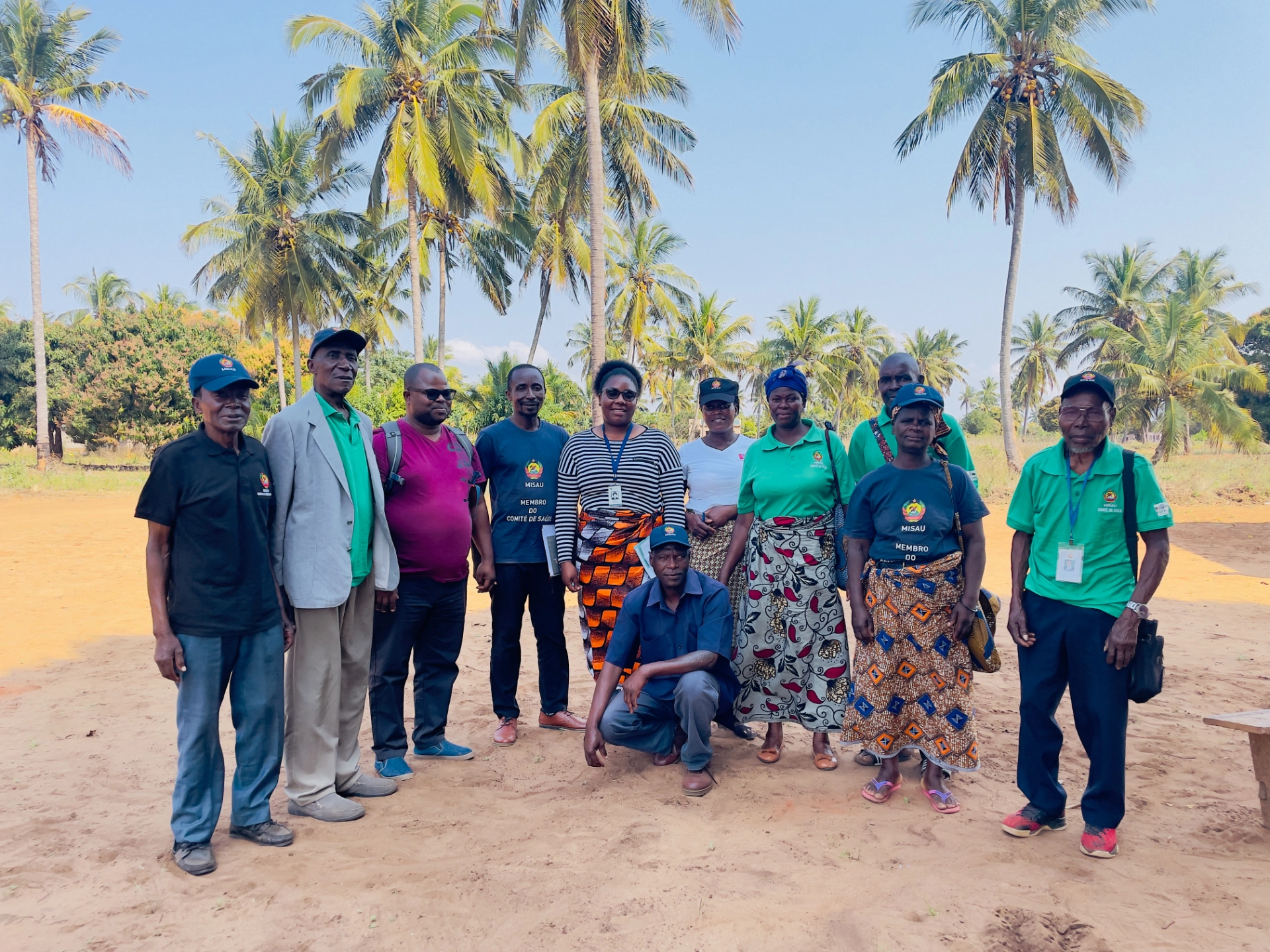 Health committee members and Matimba staff photographed together under palm trees