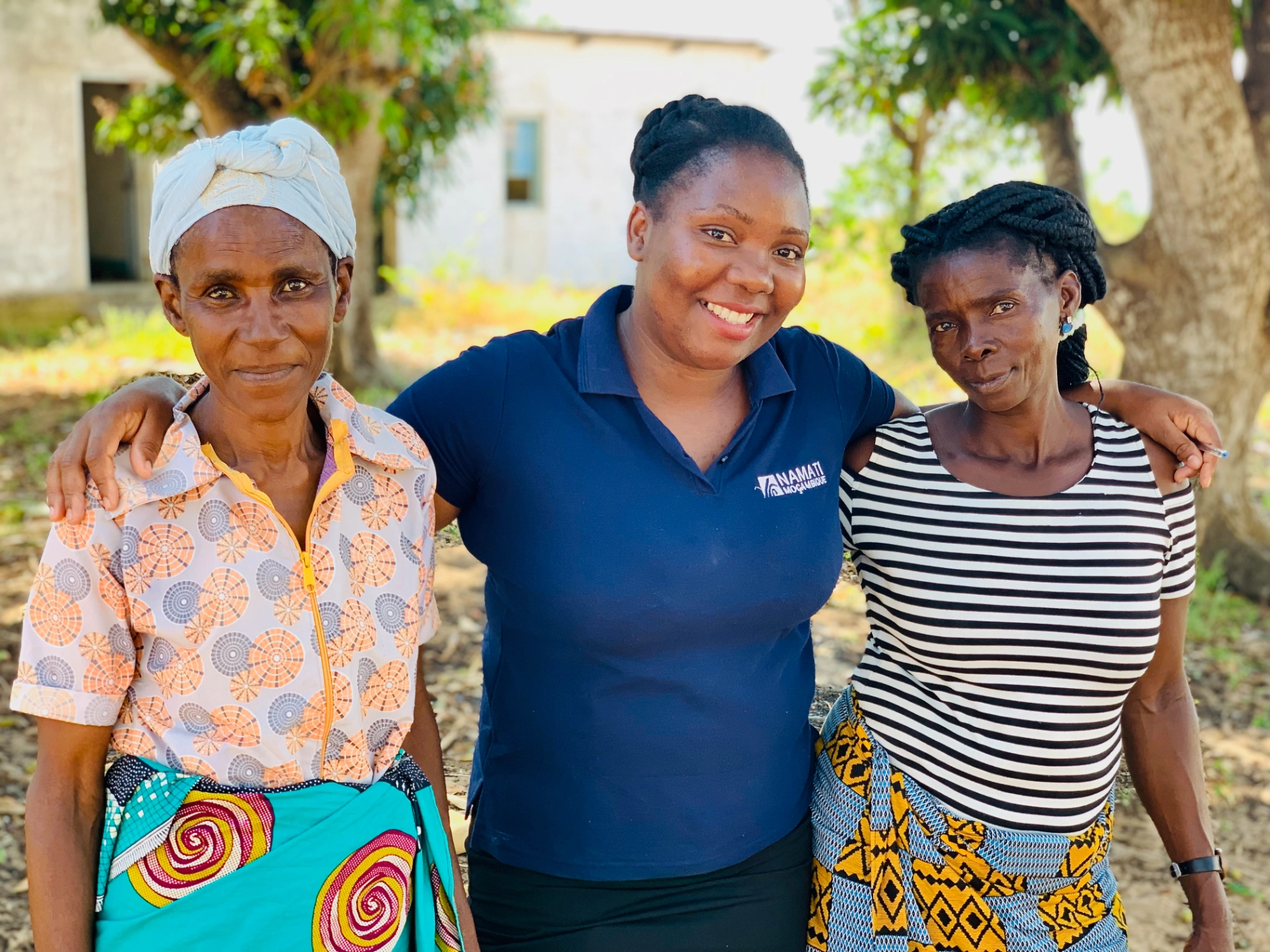 3 women with namati staff member in center
